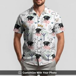 Man in dinosaur Hawaiian shirt featuring custom dog face, green dino shapes, and hearts