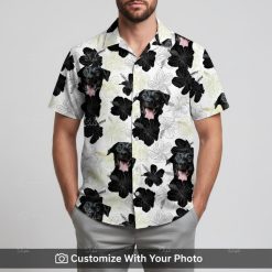 Man in trendy black and white Hawaiian shirt with bold dog face print and flowers