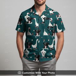 Man in custom dog face Hawaiian shirt with geese, red mushrooms, teal background