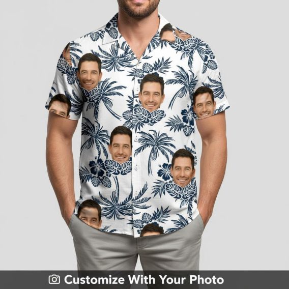 Man wearing black and white Hawaiian shirt featuring custom face print, palm trees, and flowers