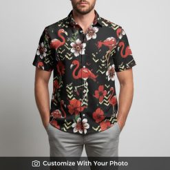 Man on vacation in black Hawaiian shirt featuring red flamingos and flowers