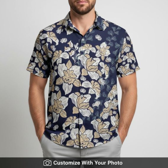 Man modeling navy floral Hawaiian shirt with swirled vines, beige and white flowers