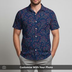 Man in navy floral Hawaiian shirt showing red and beige branching botanical design
