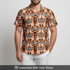 Man in Halloween Hawaiian shirt with orange jack-o'-lanterns, ghosts, and skulls design