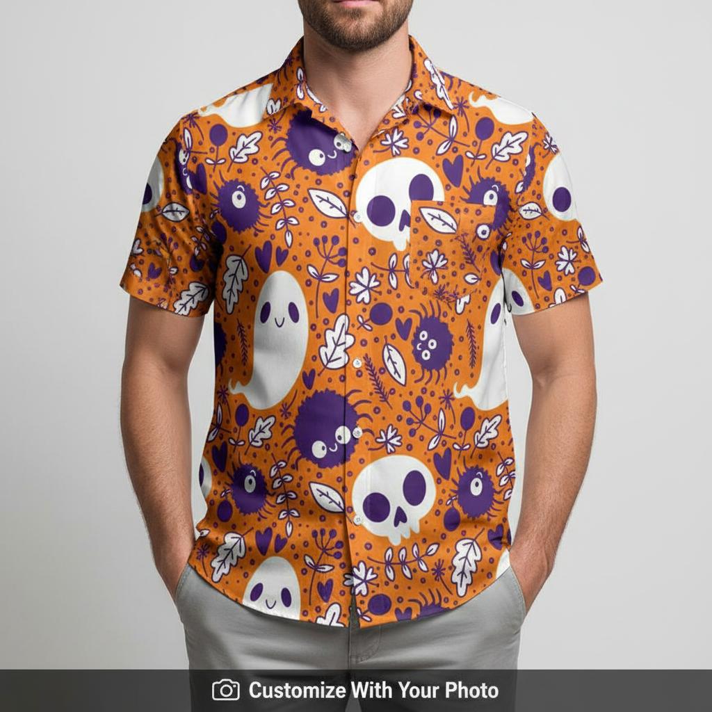 Man in Halloween button-up shirt with skulls, ghosts and colorful leaf details