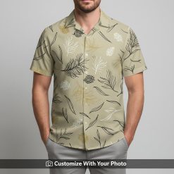 Man in casual beige Hawaiian shirt featuring gold and black abstract floral print
