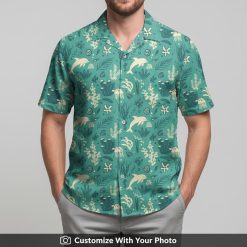 Man wearing dolphin and jellyfish print Hawaiian shirt with teal and yellow colors