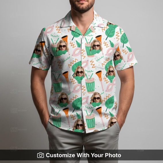 Man in vibrant custom Hawaiian shirt with sunglasses face and green leaf design