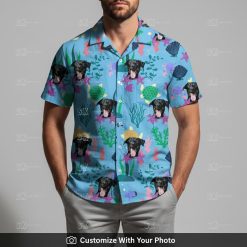 Man in Hawaiian Spongebob shirt featuring black dog, starfish, and seaweed colors
