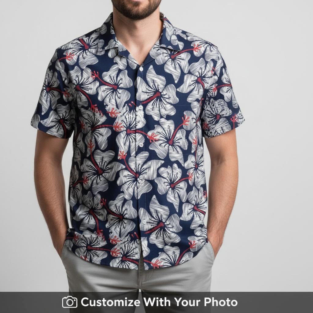 Man wearing navy blue Hawaiian shirt with large white and red hibiscus design