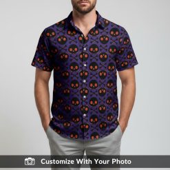 Man showing off purple and black skull crossbones Halloween Hawaiian shirt
