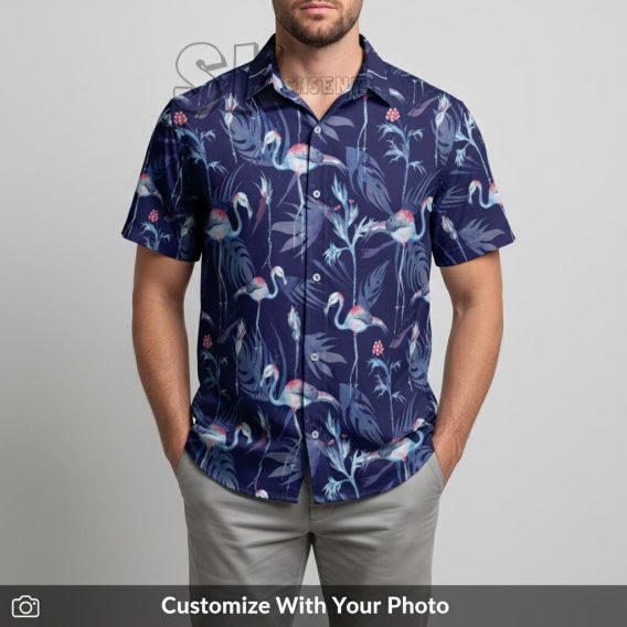 Man in purple Hawaiian shirt with pink flamingos and tropical leaves at a beach