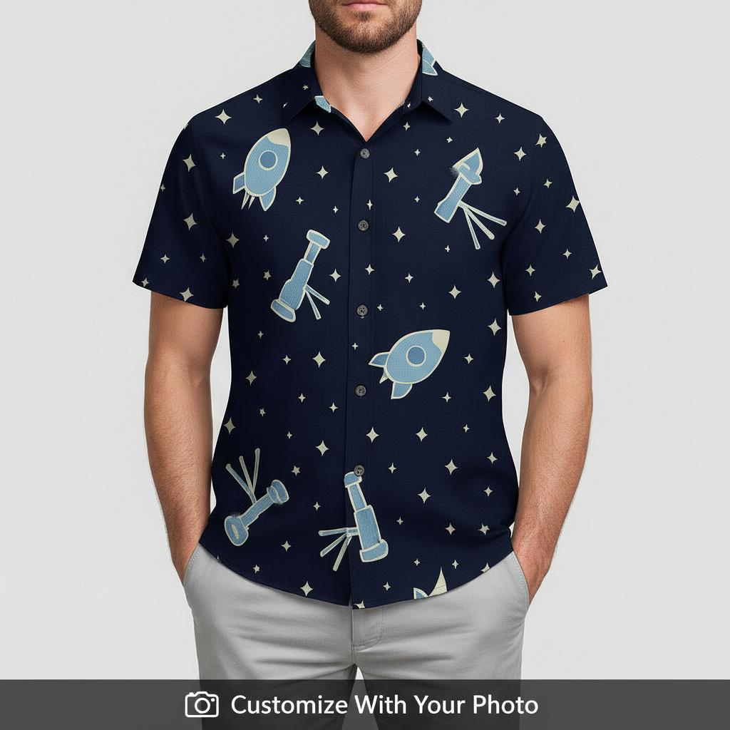 Man in R2-D2 Hawaiian shirt featuring rockets, telescopes, and stars on blue fabric