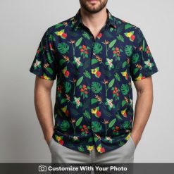 Man in a tropical floral Hawaiian shirt with monstera and bird of paradise pattern