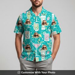 Man in turquoise Hawaiian shirt featuring cocktail designs and bright tropical colors