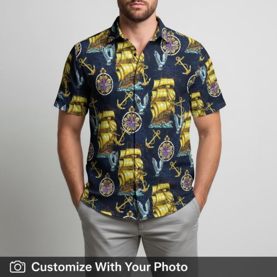 Man in navy blue vintage Hawaiian shirt with yellow sailing ships and anchors
