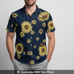 Man in vintage sunflower Hawaiian shirt featuring bold yellow blooms and navy background