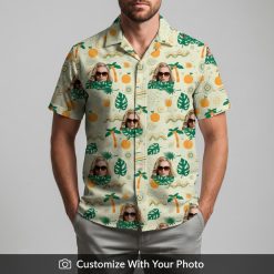 Man in white Hawaiian shirt with palm leaves, orange fruit, and custom sunglasses face print
