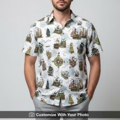 Man in white pirate ship Hawaiian shirt with vintage ships, compasses, and waves pattern