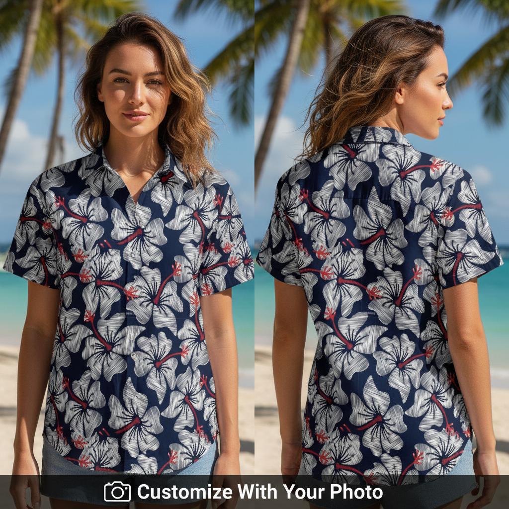 Woman in navy blue Hawaiian shirt with white hibiscus flowers and red accents