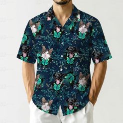 Hawaiian shirt showing cat and dog images with large green black butterflies repeated pattern