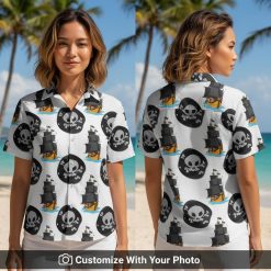 Woman wearing white pirate Hawaiian shirt with Jolly Roger skulls and sailing ships
