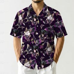 Playful hawaiian shirt with cat face prints butterflies crescent moons and flowers on dark base