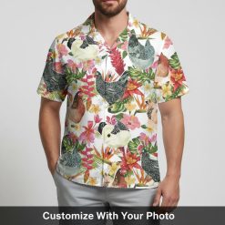 rooster hawaiian shirt with tropical chicken print worn by man on beach
