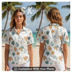 Hawaiian shirt with sea turtle face print worn by woman, pastel turtles and flowers on beach