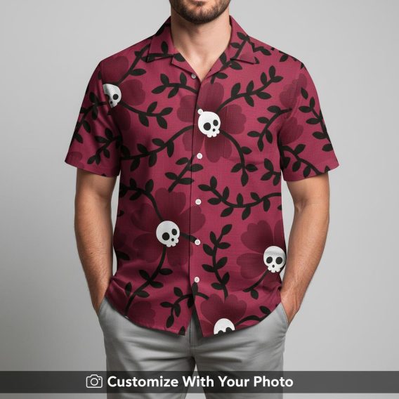 Man in burgundy Hawaiian shirt with bold skulls and floral black and white pattern