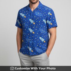 Man in Star Wars Disney Hawaiian shirt with vibrant rockets and yellow-orange accents