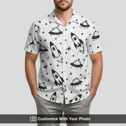 Man in black and white Star Wars Hawaiian shirt featuring rockets and stars