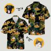 Dog and cat faces printed on tropical button up shirt with yellow flowers