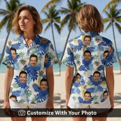 Woman wearing blue and white Hawaiian shirt with custom face print and tropical leaves