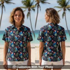 Woman in toucan and cactus print navy shirt, blue orange leaves, beach boardwalk
