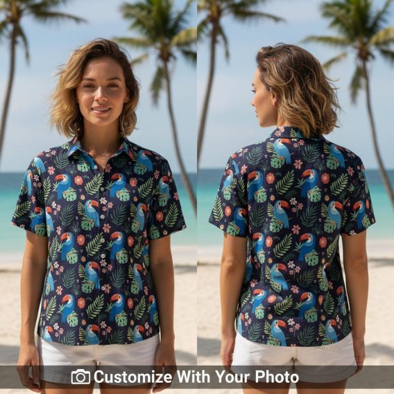 Woman in toucan and cactus print navy shirt, blue orange leaves, beach boardwalk