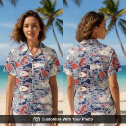 Woman wearing ocean Hawaiian shirt with sea turtles, fish, stingrays and coral details