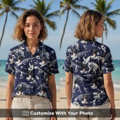 Woman wearing T Rex Hawaiian shirt with dog face, dark blue and white skeleton print