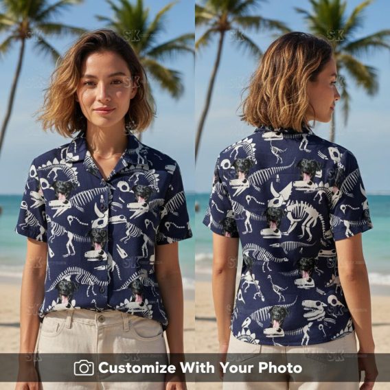 Woman wearing T Rex Hawaiian shirt with dog face, dark blue and white skeleton print