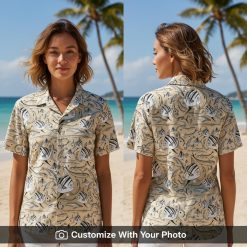 Woman wearing fish print hawaiian shirt with black and beige tropical fish motifs