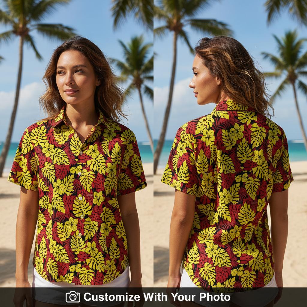 Woman in bold red and yellow floral Hawaiian shirt with monstera leaves and hibiscus flowers
