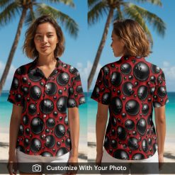 Woman wearing red and black bowling shirt with black bowling ball pattern design