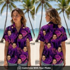 Woman wearing a black and purple Hawaiian shirt with custom face and tropical leaves