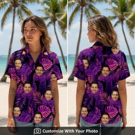 Woman wearing a black and purple Hawaiian shirt with custom face and tropical leaves
