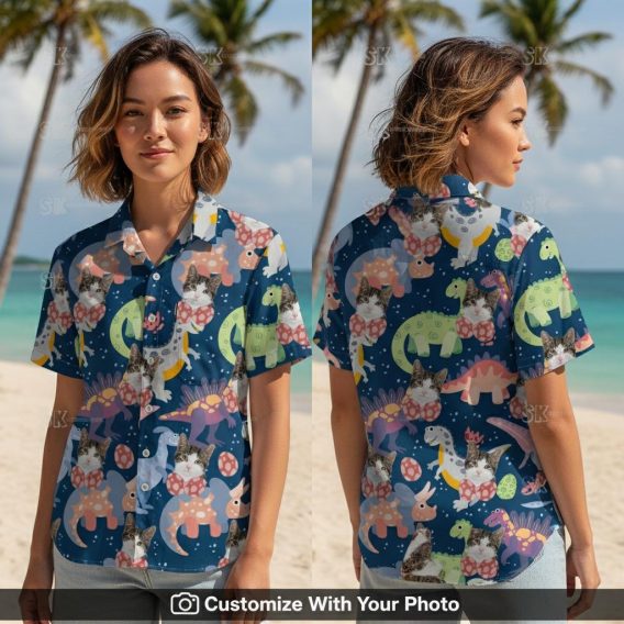 Woman wearing cat Hawaiian shirt with cartoon dinosaurs, navy and pink summer print