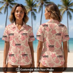 Woman wearing custom embroidered Hawaiian shirt with pink beige tropical leaf design