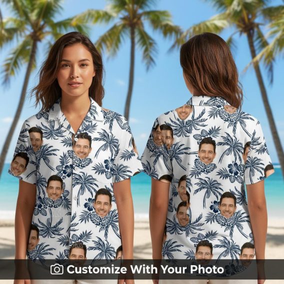 Woman wearing a black and white Hawaiian shirt with custom face print, palm trees, and hibiscus flowers