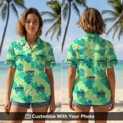 Woman wearing custom logo Hawaiian shirt with teal and green monstera leaves outdoors