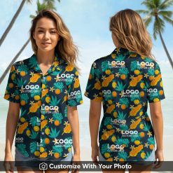 Woman wearing custom logo Hawaiian shirt with orange fish, tropical leaves and teal flowers