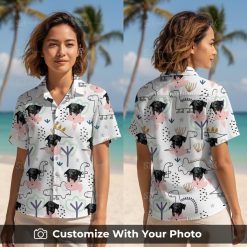 Woman wearing dinosaur Hawaiian shirt with custom dog face, hearts, and colorful dinosaurs